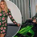 Amanda Holden looks glam  as she straddles a motorbike in a floral mini dress