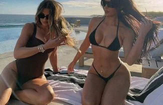 Kim Kardashian and sister Khloe displays their knockout swimsuit bodies as they wrap their LEGS around each other in sunkissed Los Cabos vacation snaps