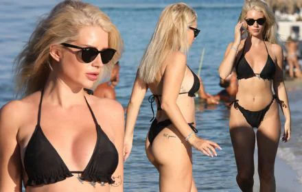 Lottie Moss flaunts her flawless frame in a black bikini as she goes for a dip in the sea