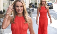 Amanda Holden shows off her toned figure in elegant red outfit